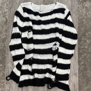 Women’s baggy black and white distressed sweater